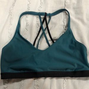Under Armour dark teal and black sports bra. NWOT.